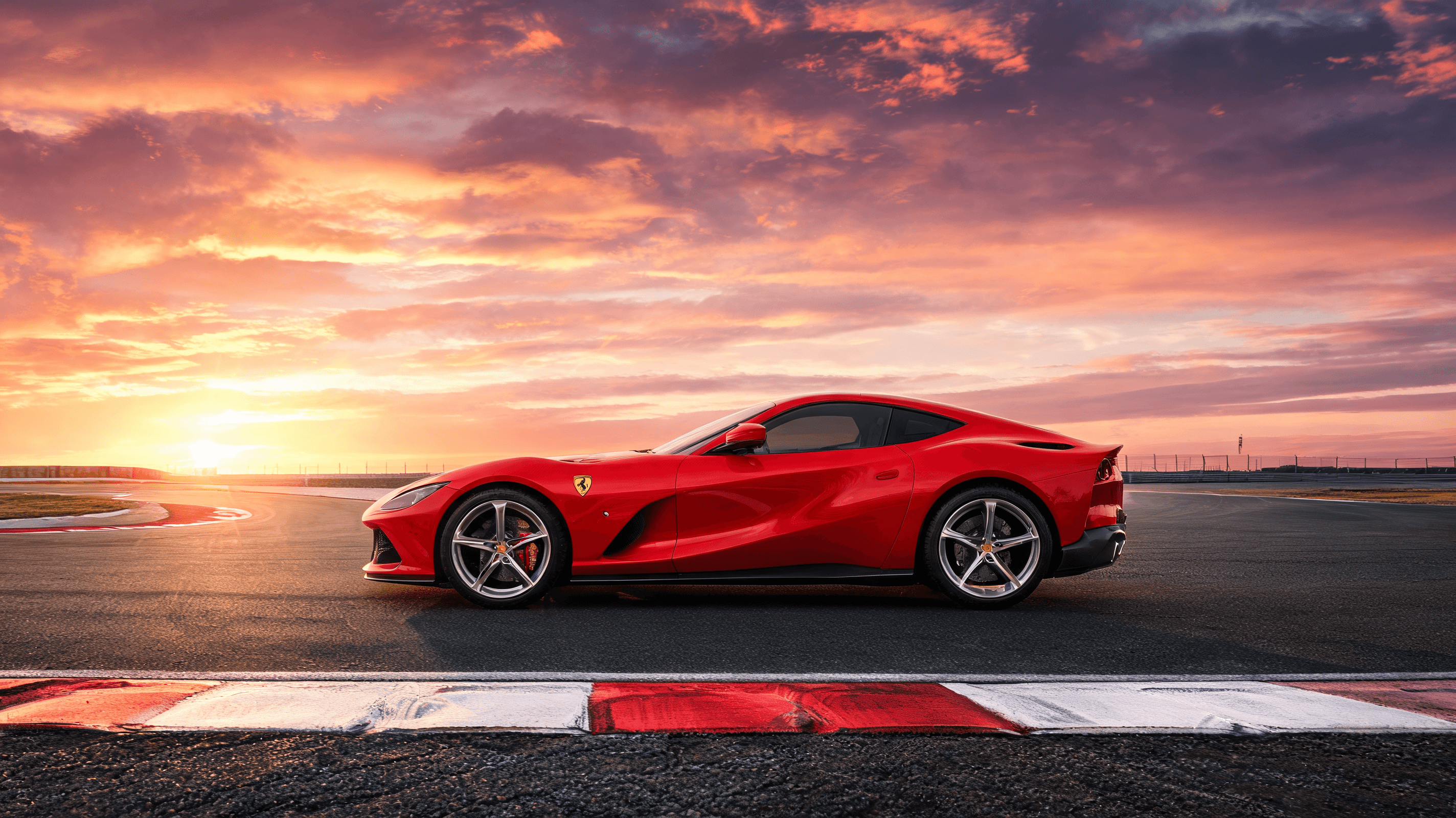 A side-profile shot of the Ferrari Luce electric sports car on a racetrack, contrasting modern minim