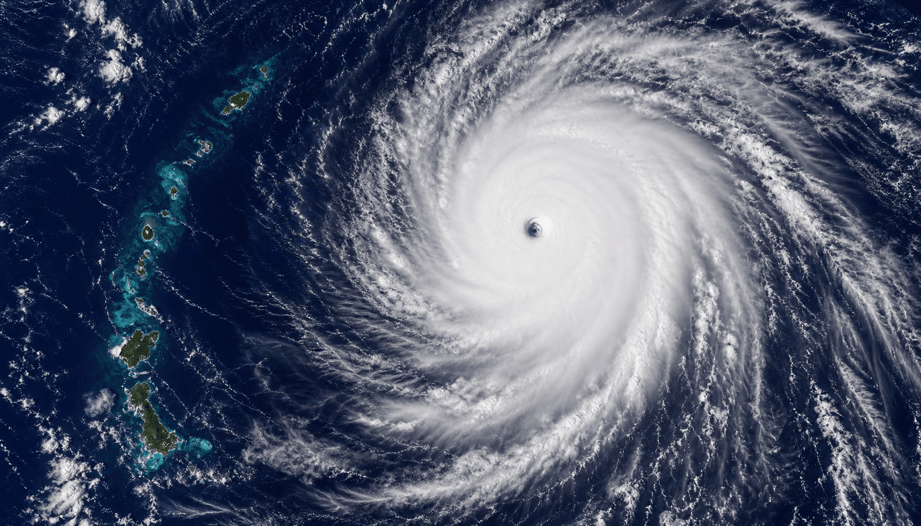 A satellite view of a massive Category 5 super typhoon with a clear eye, swirling over the Pacific O